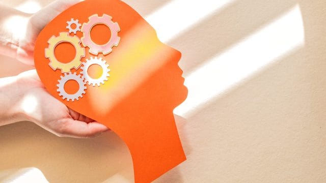 Silhouette of human head with gear figure – Concept of mental health, World Mental Health Day